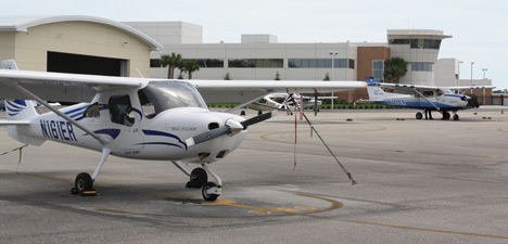 photo of a small airplane at airport.